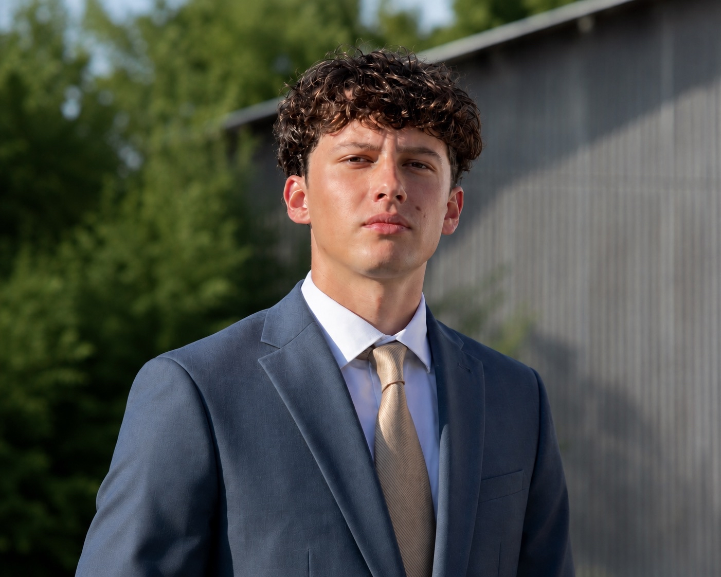 Alex Alberti in a blue suit outdoors